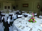 White Chair Covers and Chocolate Taffeta Sash